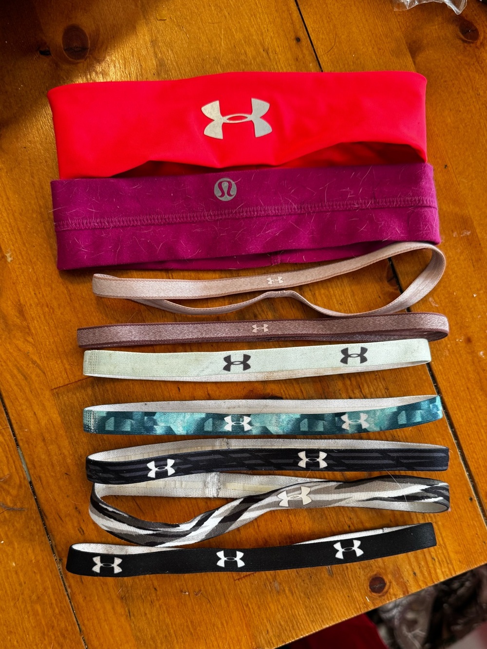 Assortment of Under Armour and Lululemon headbands